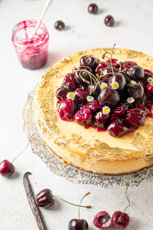 Tahitian Vanilla Bean Cheese Cake with Cherries and Edible Gold Leaf